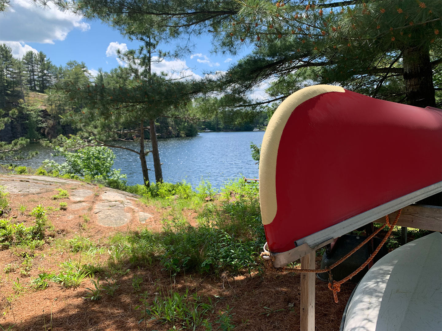 Red canoe protected with a pair of yellow Kevlar Skid Plates United States